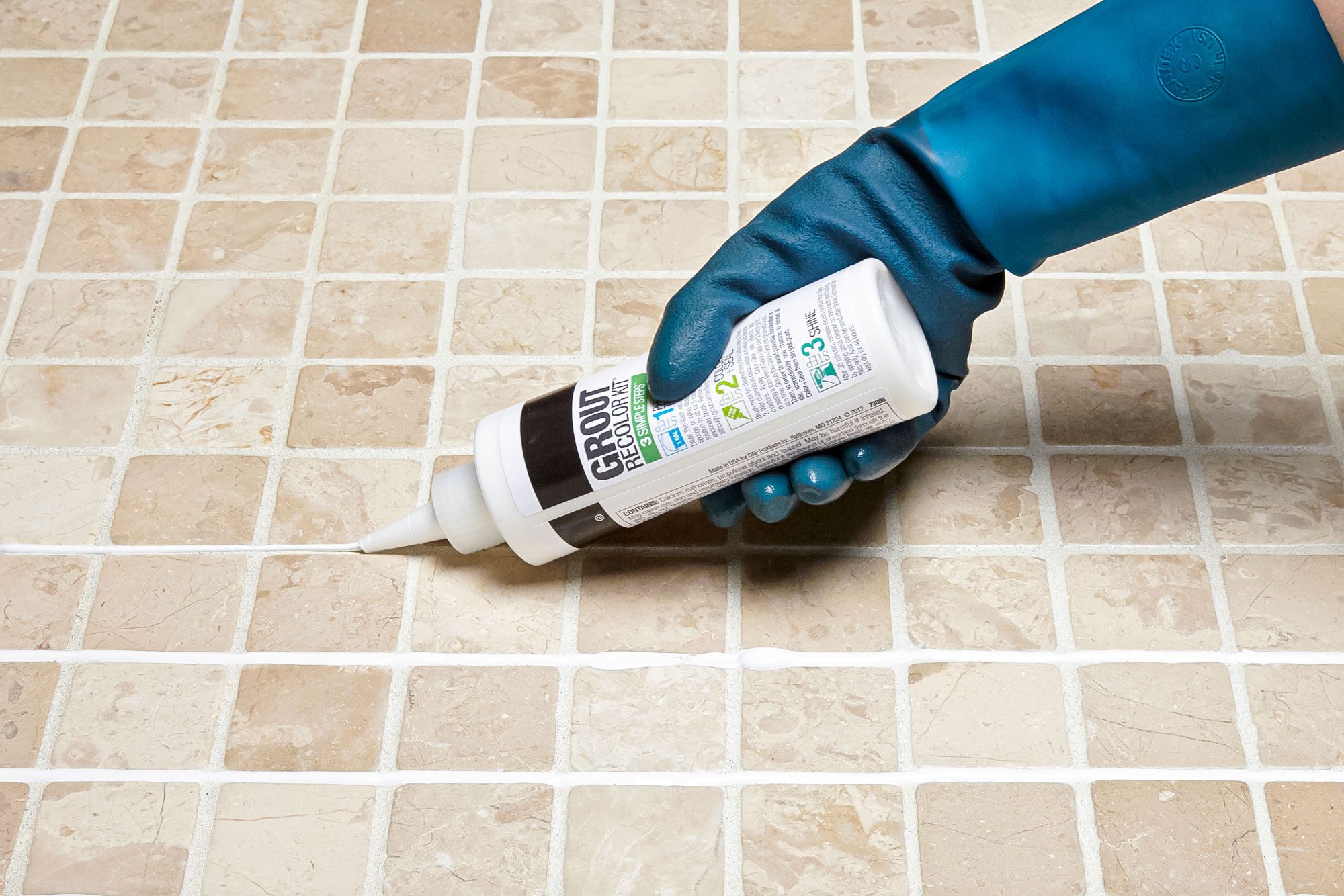 How To Whiten Grimy Grout, Applying Grout on Tiles with Hand wearing Rubber Gloves