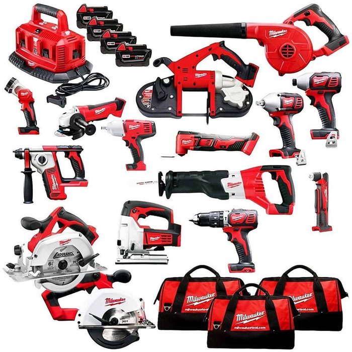 A collection of red and black power tools is neatly arranged. Tools include drills, saws, and a charger, surrounded by carrying bags.