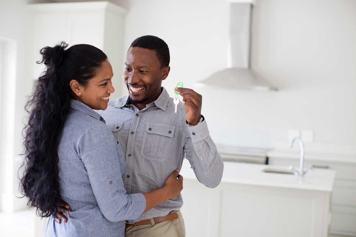 Couple Holding Keys Gettyimages 565887175