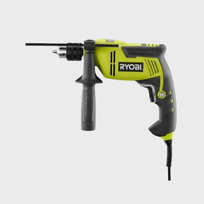 A yellow and black electric drill features a chuck with a drill bit, designed for rotary action in a workshop or construction setting.