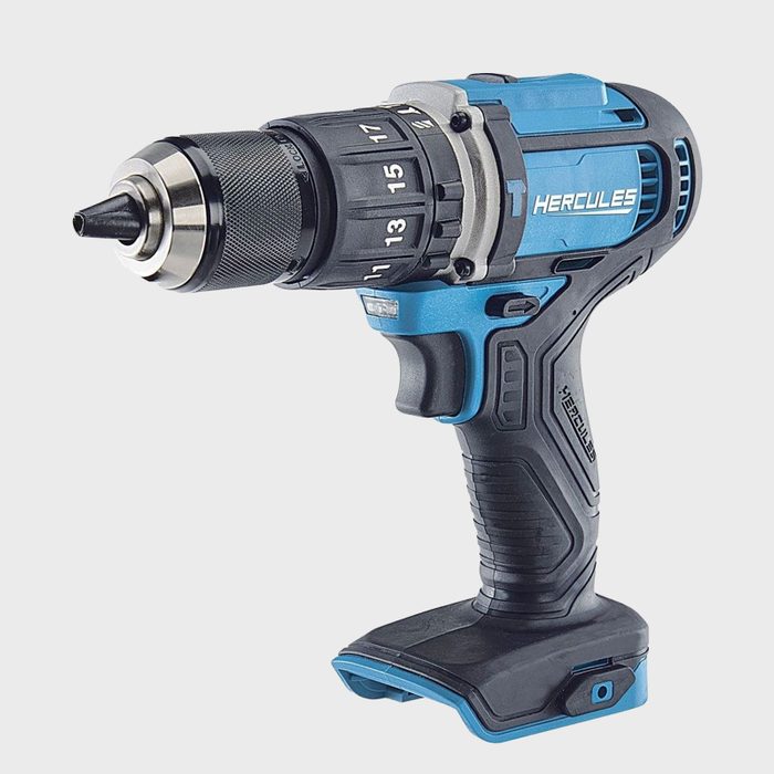 A cordless drill, colored blue and black, is positioned upright, ready for use, with a visible drill bit, designed for tasks in various settings.