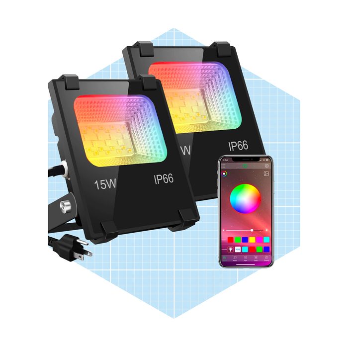 Two colorful LED floodlights, labeled 15W and IP66, are displayed alongside a smartphone showing a color selection interface against a light blue grid background.