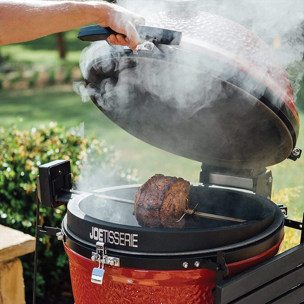 Joetisserie on a smoker with a chicken