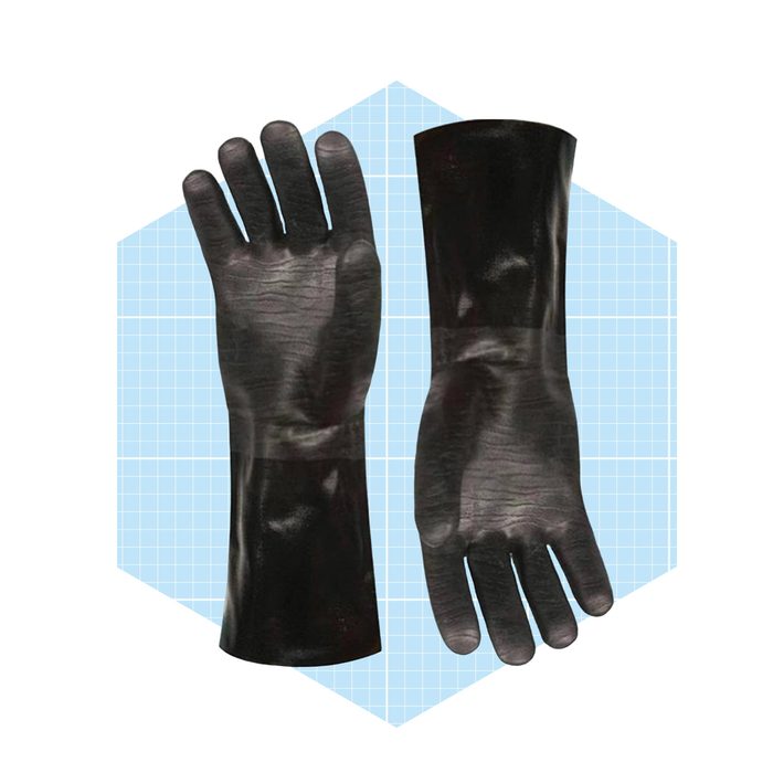 Two black rubber gloves are laid flat, displaying their palm and wrist areas against a light blue grid background.