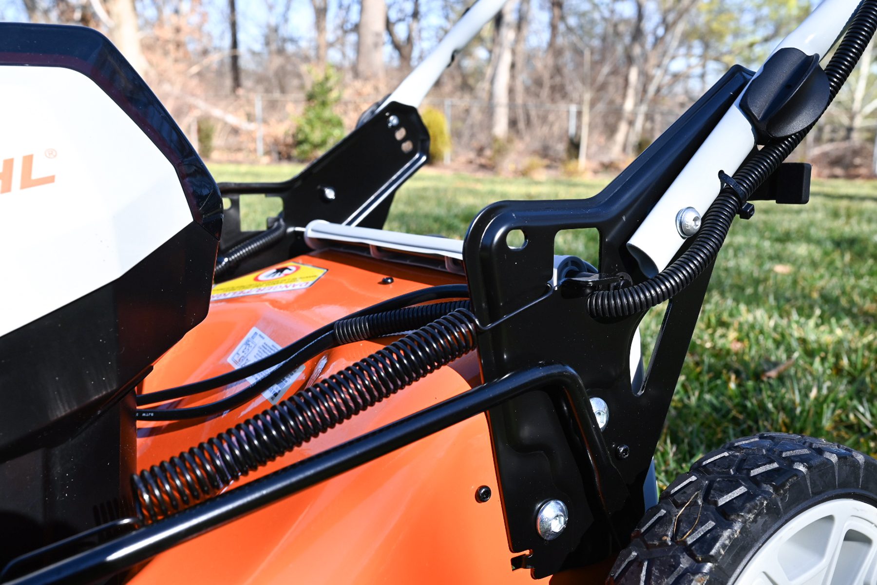 A lawn mower with a handle attached to it.