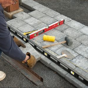 Installing patio cement paving bricks