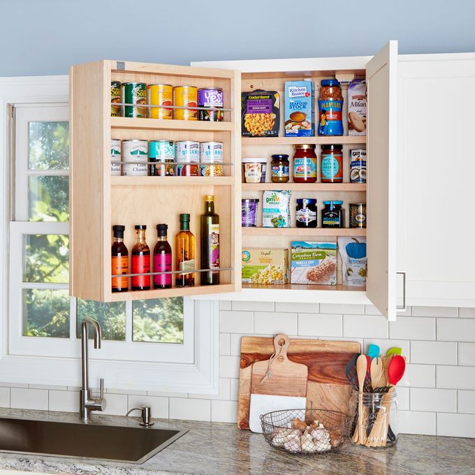 Organized kitchen cabinet with a pull out shelf